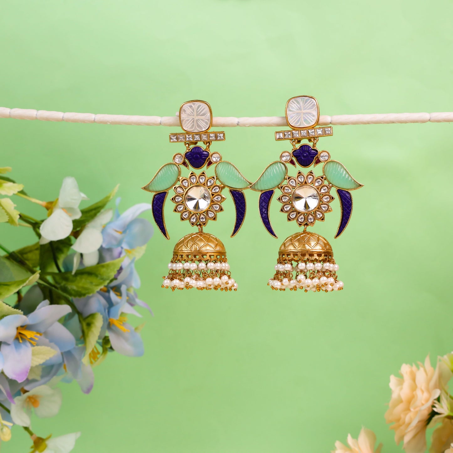 Indo-Western Style Mother of Pearl Earrings adorned with sea green and blue carved glass stones, delicate hanging moti (pearls), and intricate Kundan work