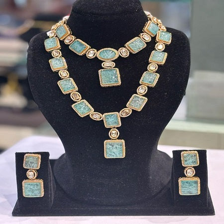 An absolute Showstopper Indo-Western Long-Short Jewelry Sets: AD & Kundan Embellishments with Bold Sea Blue Stones in Brass Metal