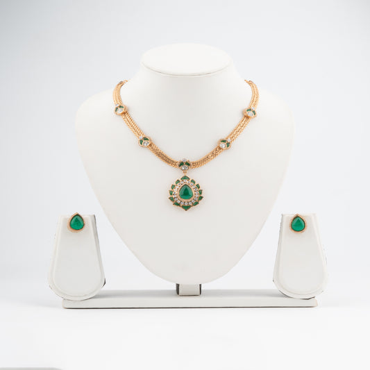 Regal Grace: Emerald-Embellished Kundan, AD Pendant necklace Set in Gold Finish"