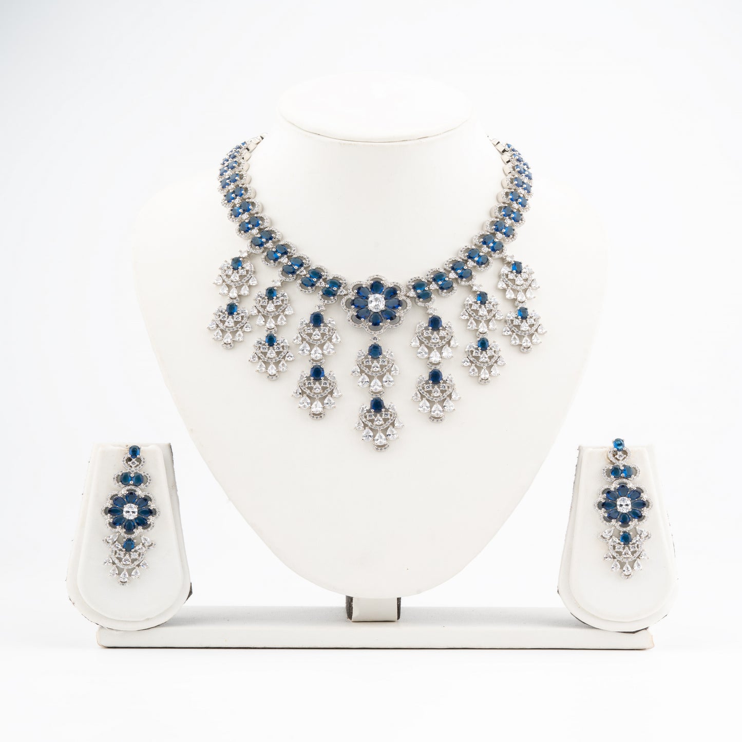 Luxurious Blue Radiance-A bold and symmetrical chandelier-style layout American Diamond Necklace & Earrings Set