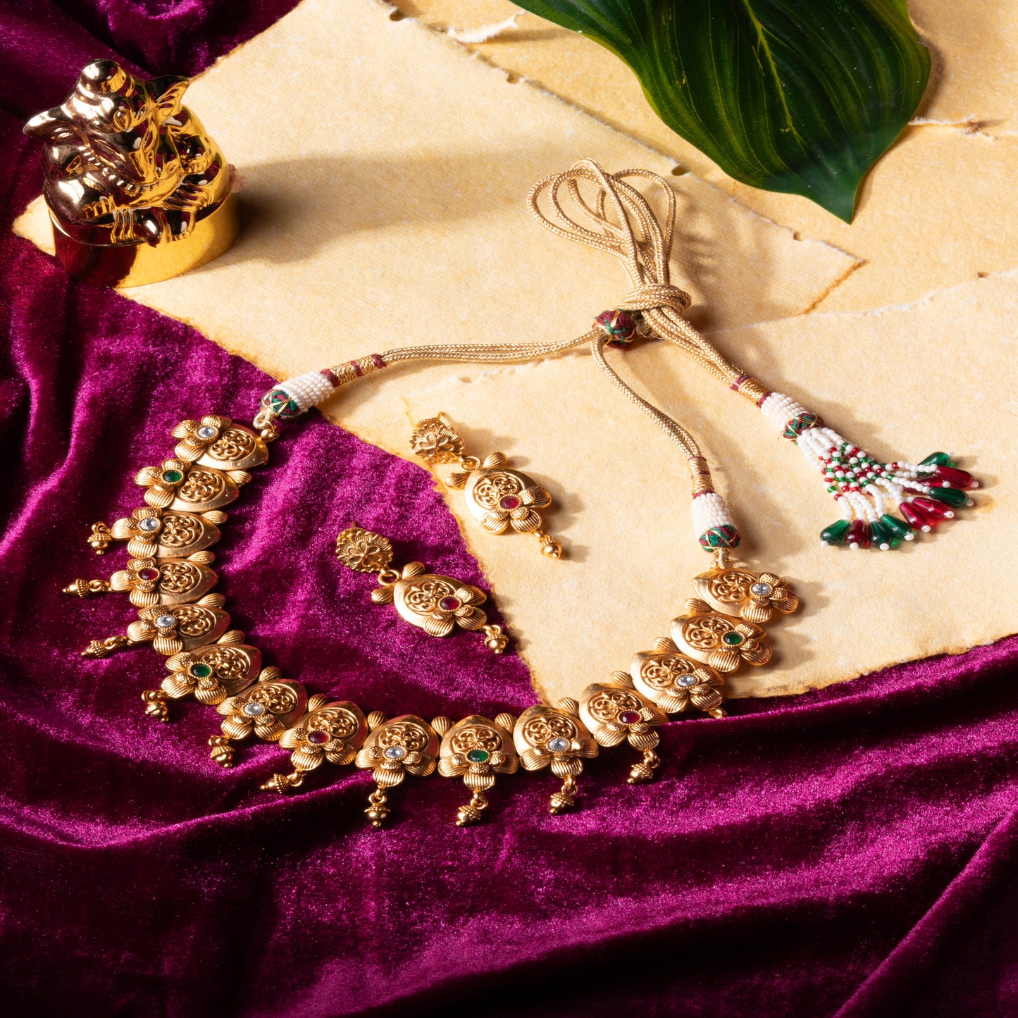 Embrace Heritage: Brass Temple Necklace with Leaf Detailing & Gem Accents