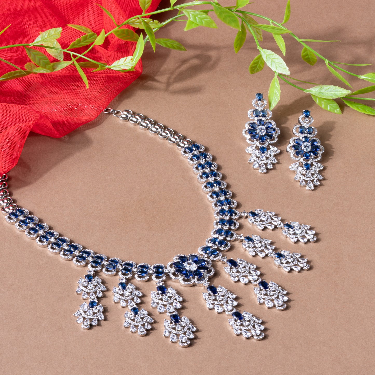Luxurious Blue Radiance-A bold and symmetrical chandelier-style layout American Diamond Necklace & Earrings Set