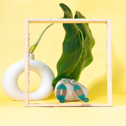 American Diamond studded Oval Green carved Stone Earrings with Antique Rhodium and Gold Polish