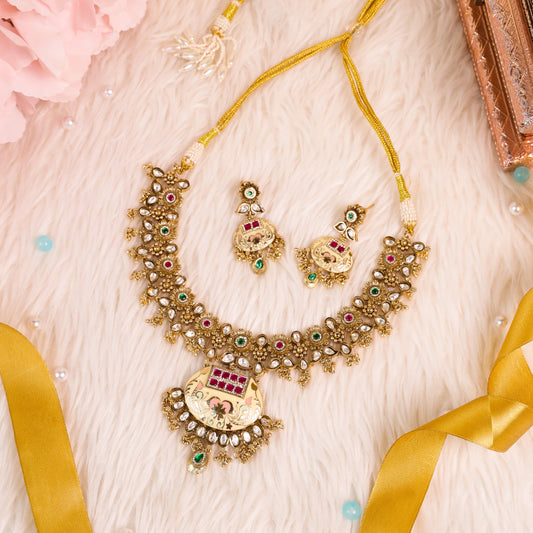 Antique Gold polished Rajwadi necklace with meenakari work studded with polki, kundan embellishments
