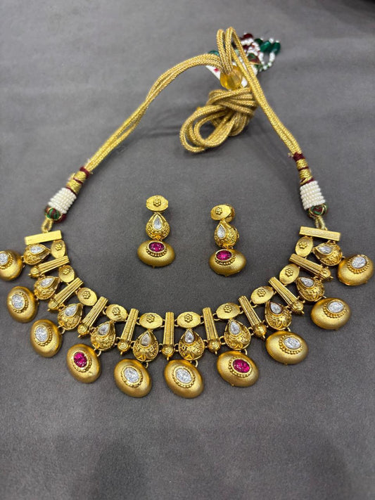 Kadi style Gold polished Rajwadi necklace set adorned with Kundan and Rubi stones