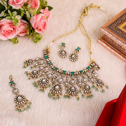 Stunning Moissanite Kundan Set with Sea-Green Droppings, Intricate Gold-Toned Setting, and AD (American Diamond) Embellishments for a Grand and Graceful Look