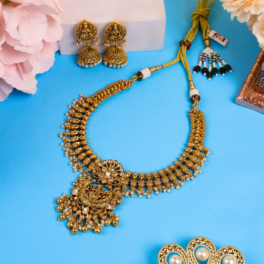 Exquisite Antique Temple-Style Necklace with Sitting Lakshmiji Pendant, Delicate Kundan Work, Lustrous White Pearls, and Matching Jhumkas