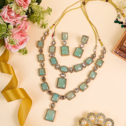 An absolute Showstopper Indo-Western Long-Short Jewelry Sets: AD & Kundan Embellishments with Bold Sea Blue  Stones in Brass Metal