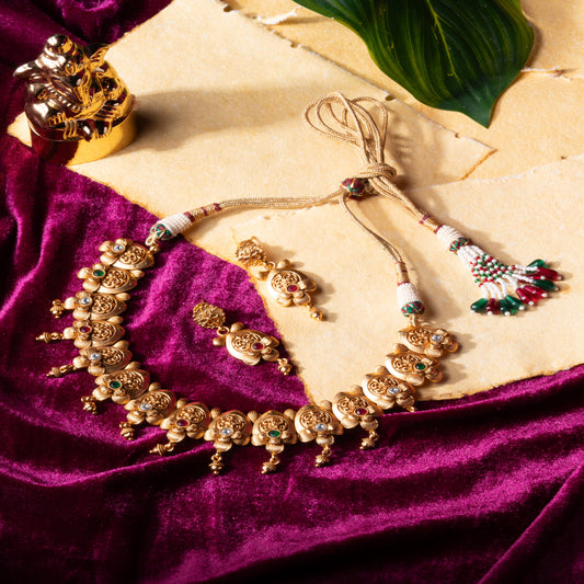 Embrace Heritage: Brass Temple Necklace with Leaf Detailing & Gem Accents